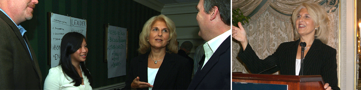 Two people engaged in a conversation at an indoor event.